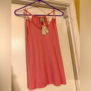 Sleeveless top with drawstrings.